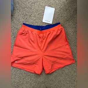 Brand new with tags mens Fabletics gym shorts orange size medium